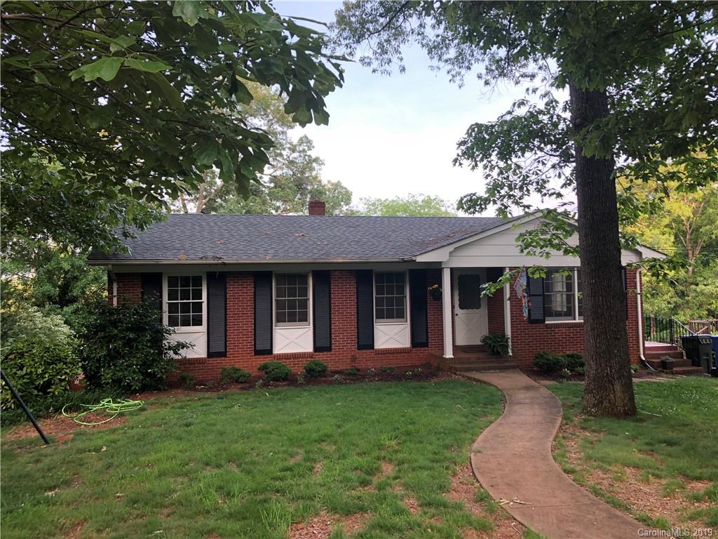 141 South Hillside Street Rutherfordton, NC 28139 - Photo 1 of 7 a front view of a house with a garden and yard