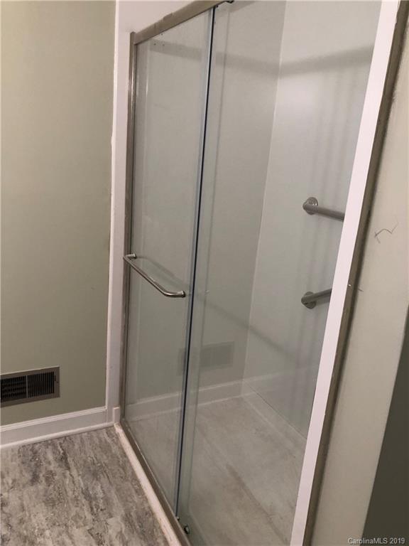 141 South Hillside Street Rutherfordton, NC 28139 - Photo 5 of 7 a bathroom with a glass door shower