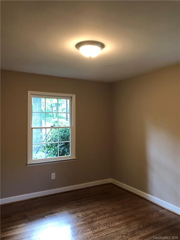141 South Hillside Street Rutherfordton, NC 28139 - Photo 7 of 7 an empty room with wooden floor and windows