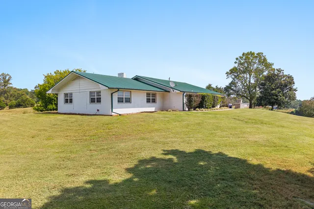 a view of a livingroom with furniture and window