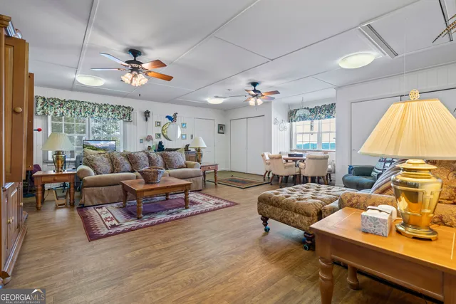 a kitchen filled with stainless steel appliances granite countertop a sink stove and refrigerator