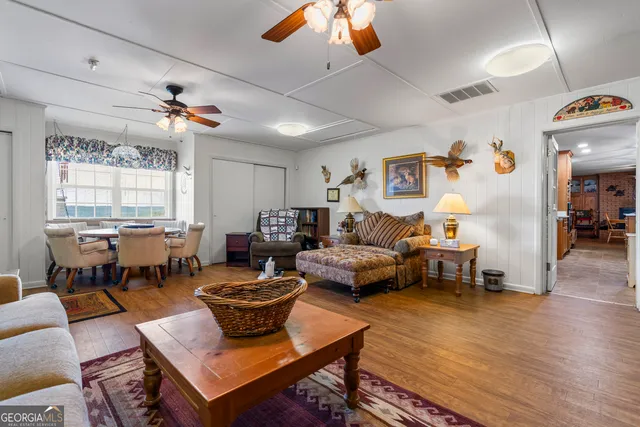 a kitchen with stainless steel appliances a stove refrigerator sink and microwave