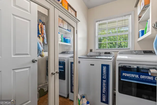 a kitchen with stainless steel appliances granite countertop a sink and a cabinets