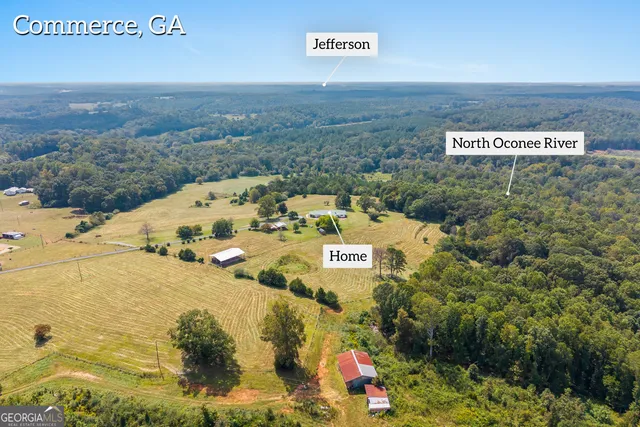a view of swimming pool with outdoor seating and yard in the back