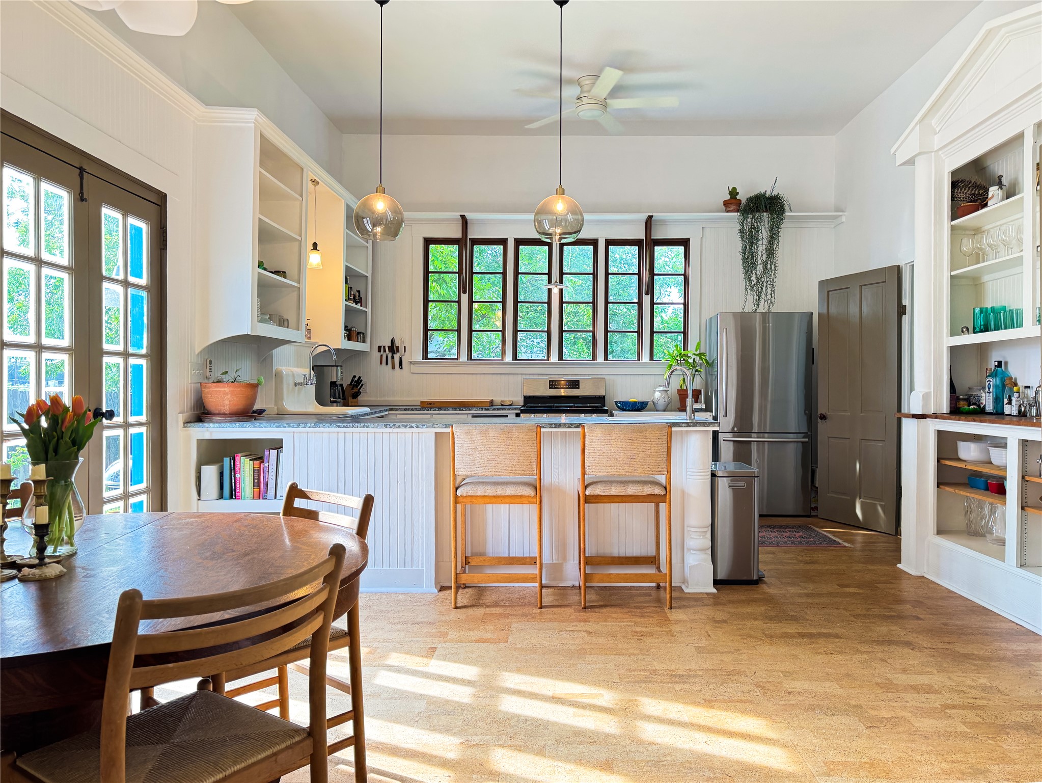 200 East Brenham Street Elgin, TX 78621 - Photo 3 of 40 An abundance of natural light flows into the kitchen and dining area