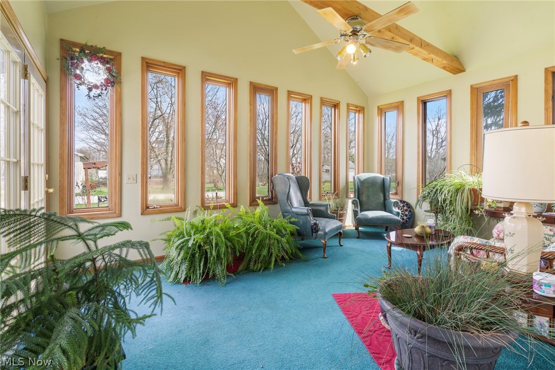 1850 South Sawburg Road Alliance, OH 44601 - Photo 15 of 39 Sunroom with ceiling fan/light and beam ceiling