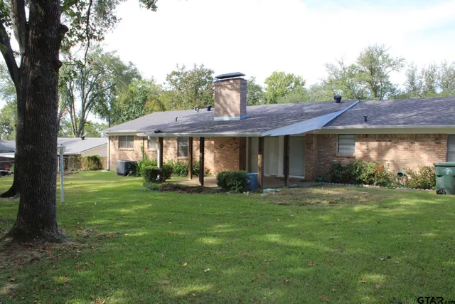 a front view of a house with a garden and porch