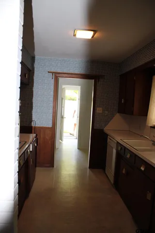 a kitchen with a sink and a stove