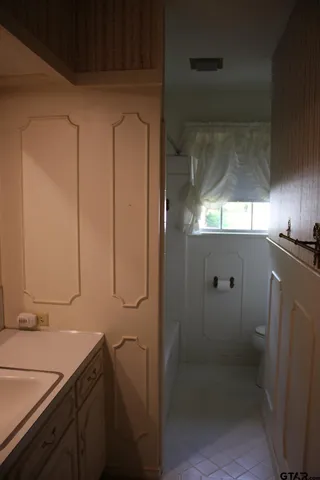 a bathroom with a double vanity sink a and a mirror