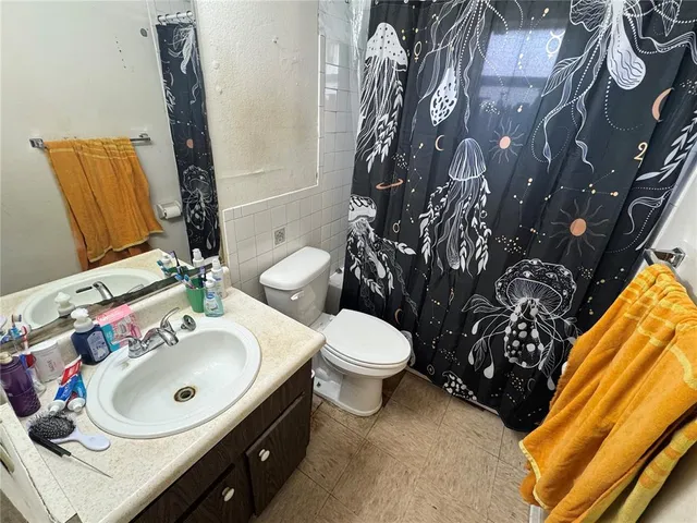 a bedroom with furniture and a bed