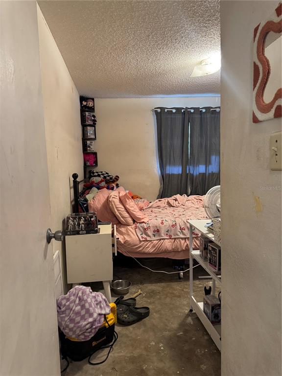 1004 Melrose Street Seffner, FL 33584 - Photo 13 of 40 a bedroom with furniture and a bed