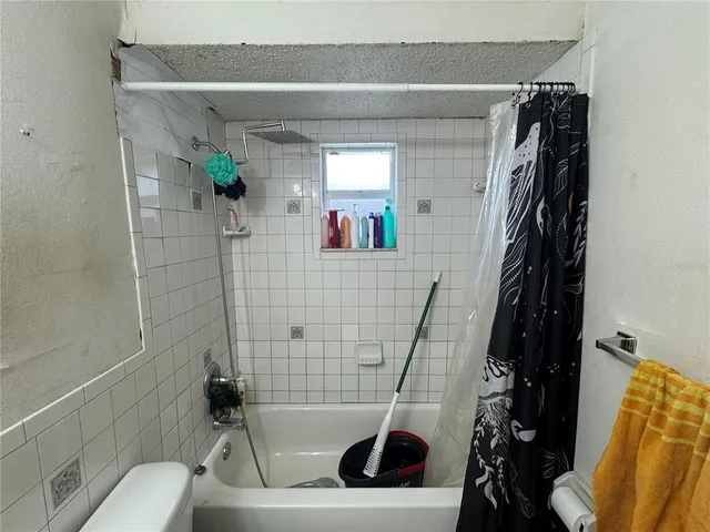 a bedroom with a bed and a table