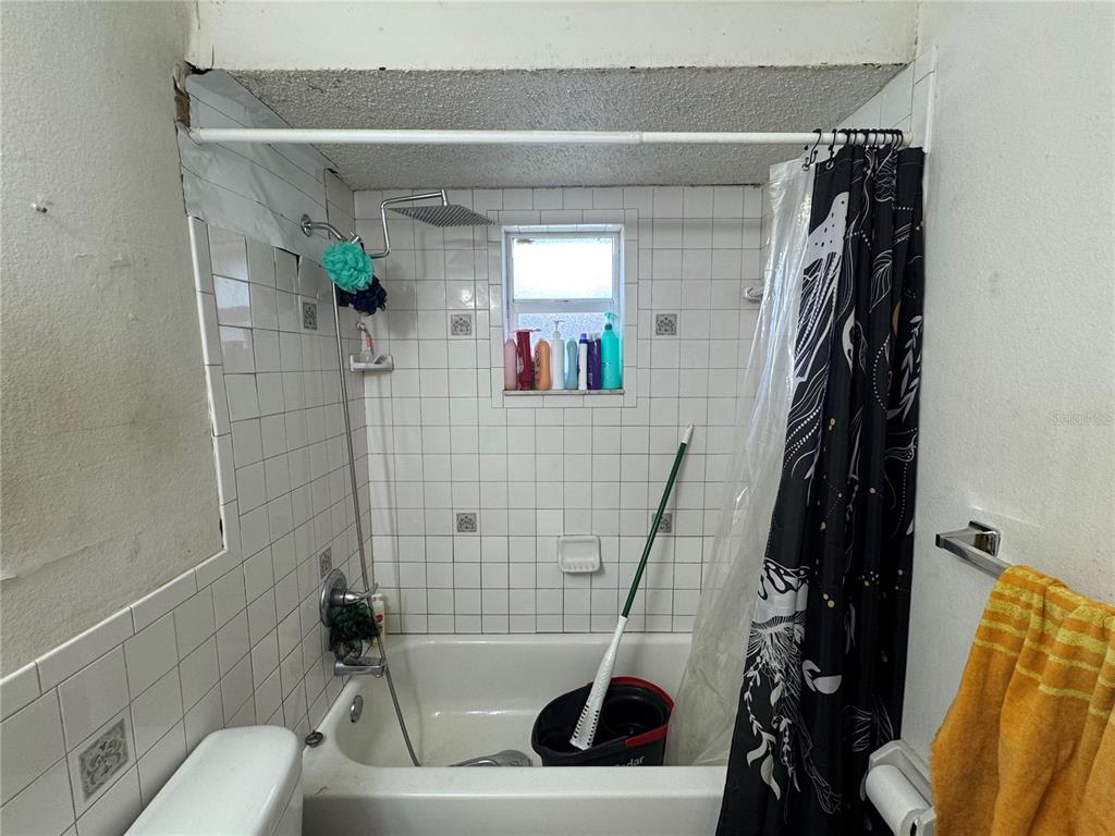 1004 Melrose Street Seffner, FL 33584 - Photo 15 of 40 a bathroom with a toilet and a shower