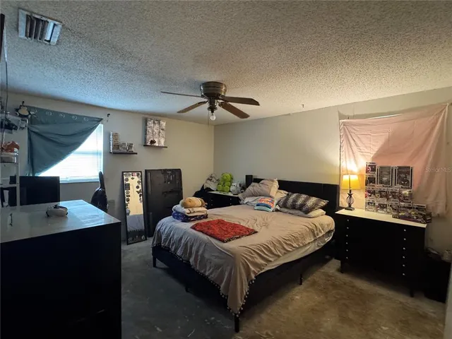 a kitchen with stainless steel appliances granite countertop a stove cabinets and wooden floor