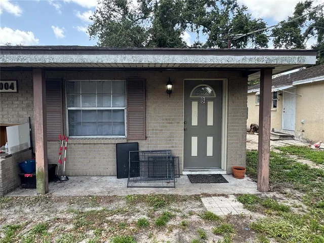 a living room with furniture window and wooden floor