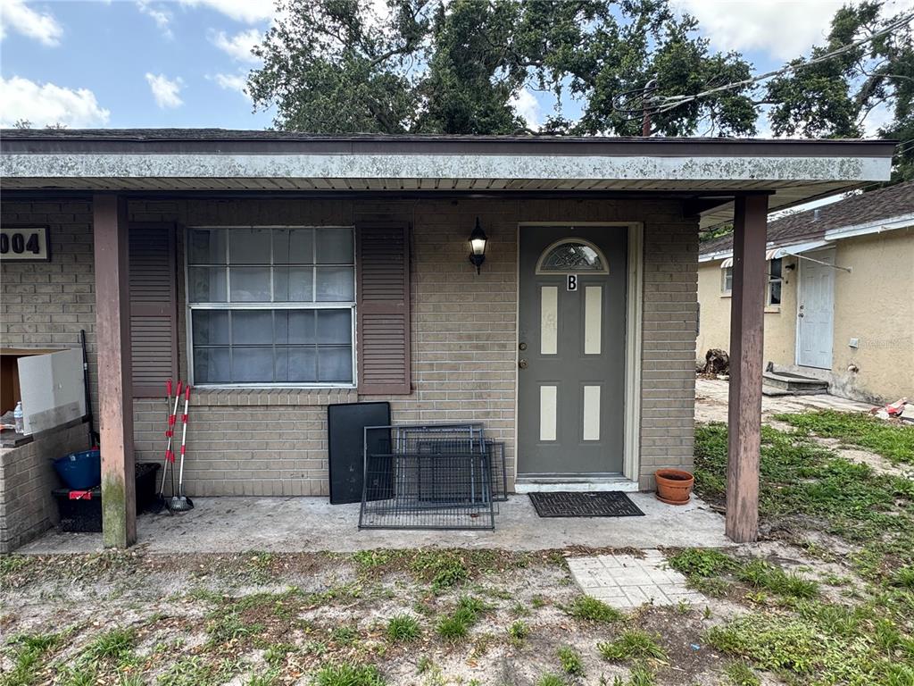 1004 Melrose Street Seffner, FL 33584 - Photo 20 of 40 a view of a house with a yard and garage