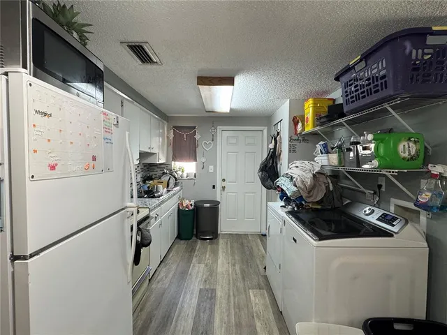 a kitchen with a stove and a refrigerator