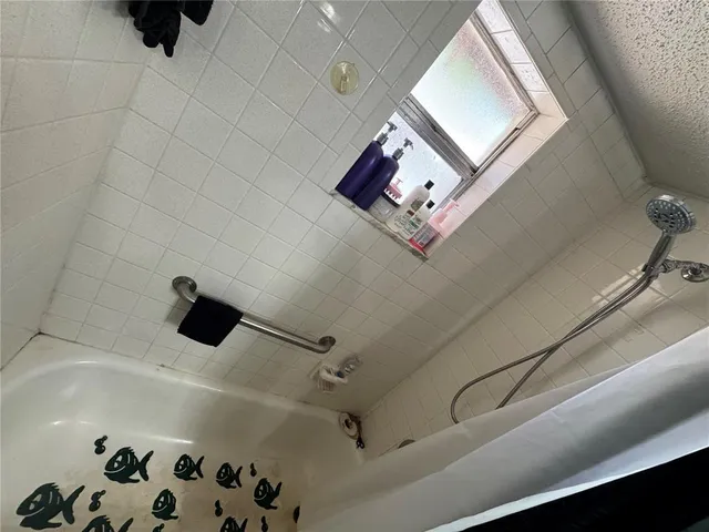 a bathroom with a sink a toilet and a bathtub