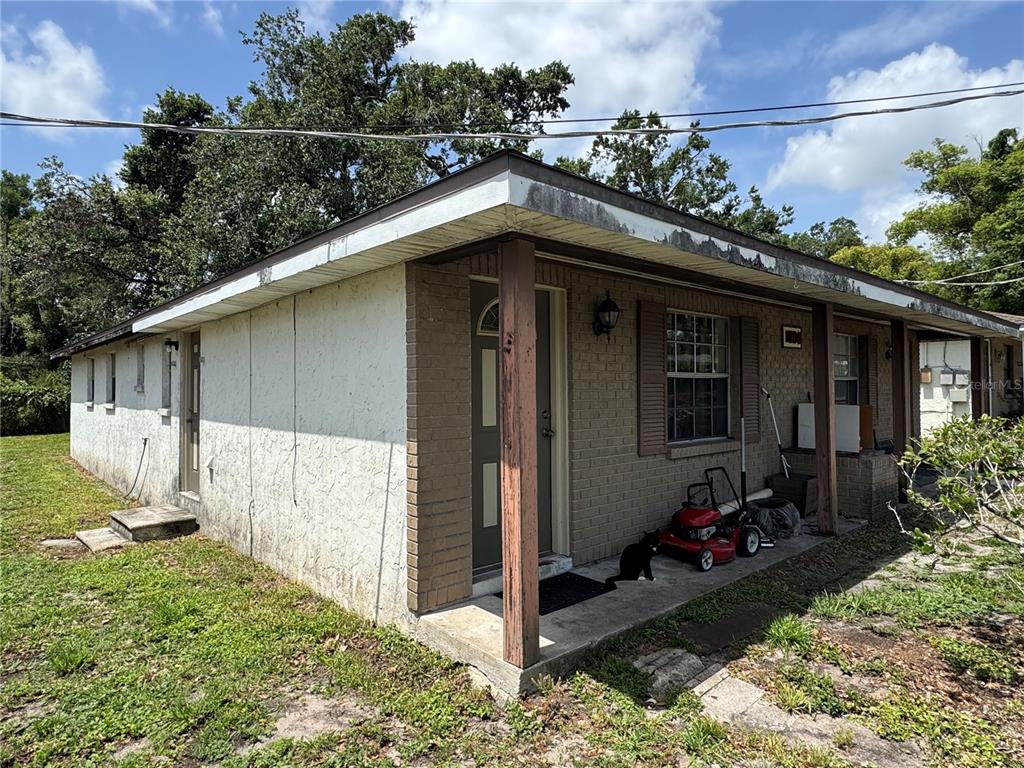 1004 Melrose Street Seffner, FL 33584 - Photo 3 of 40 a view of a house with yard and sitting area