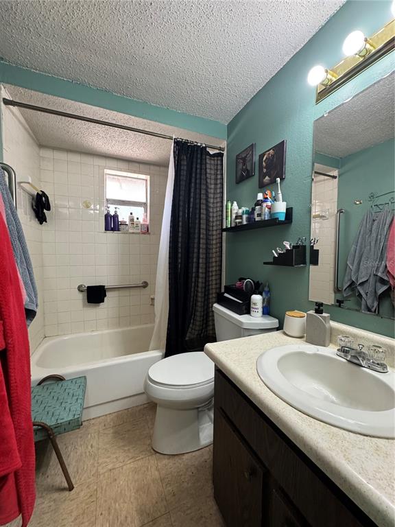 1004 Melrose Street Seffner, FL 33584 - Photo 31 of 40 a bathroom with a sink a toilet and a bathtub