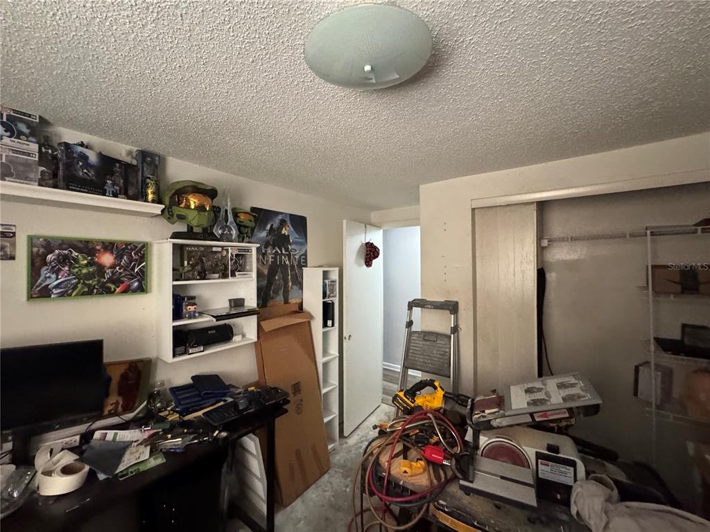 1004 Melrose Street Seffner, FL 33584 - Photo 33 of 40 a room with furniture and gym equipment