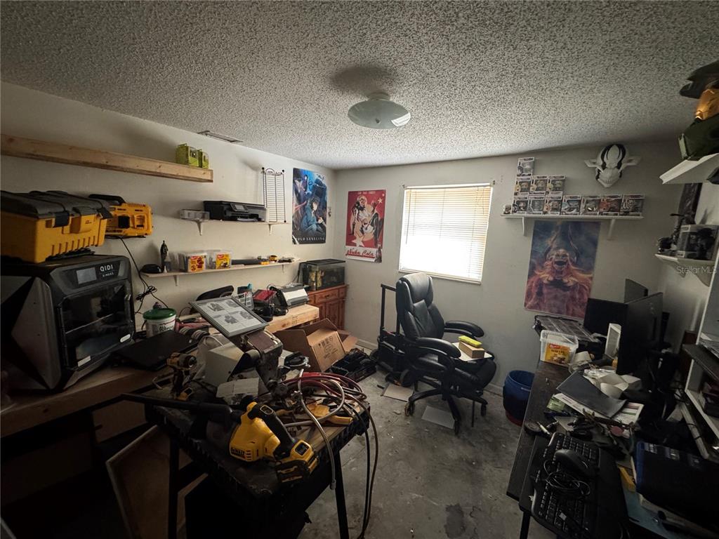 1004 Melrose Street Seffner, FL 33584 - Photo 35 of 40 a view of a room with gym equipment