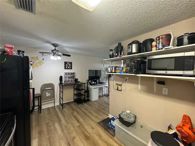 a bathroom with a sink and mirror with toilet