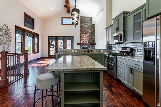 5326 North Oldgate Road Heber City, UT 84032 - Photo 10 of 32 Open-concept kitchen with sage green cabinetry and a large central island