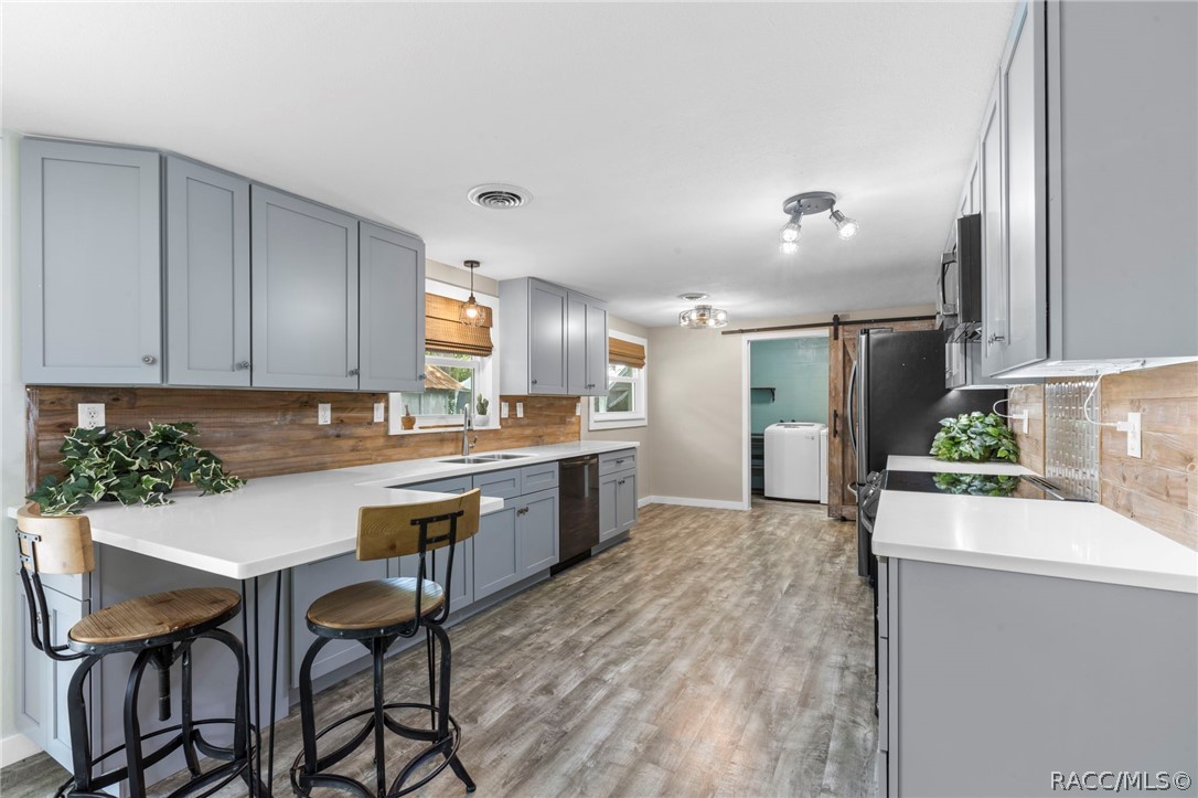107 Allen Avenue Inglis, FL 34449 - Photo 8 of 36 a kitchen with a table and chairs in it