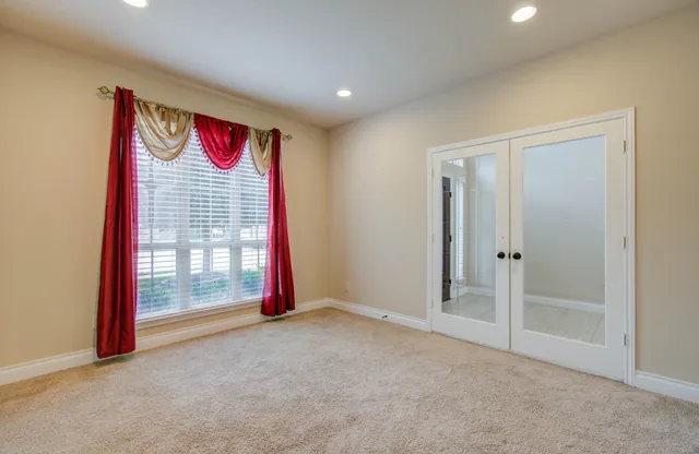 a view of an empty room and window