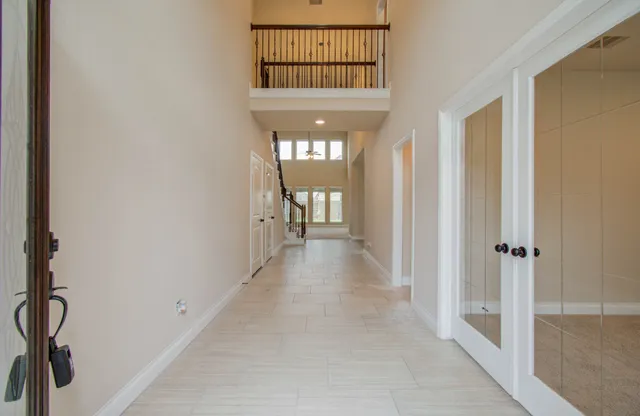 a view of a hallway with a window and a yard