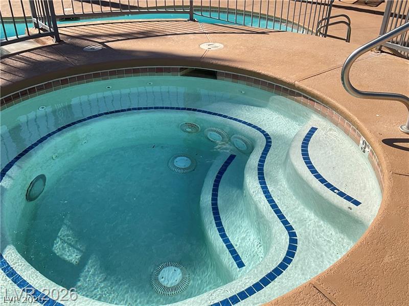 3318 North Decatur Boulevard, Unit 2152 Las Vegas, NV 89130 - Photo 39 of 58 Relax in the inviting spa, a perfect retreat on sunny afternoons.