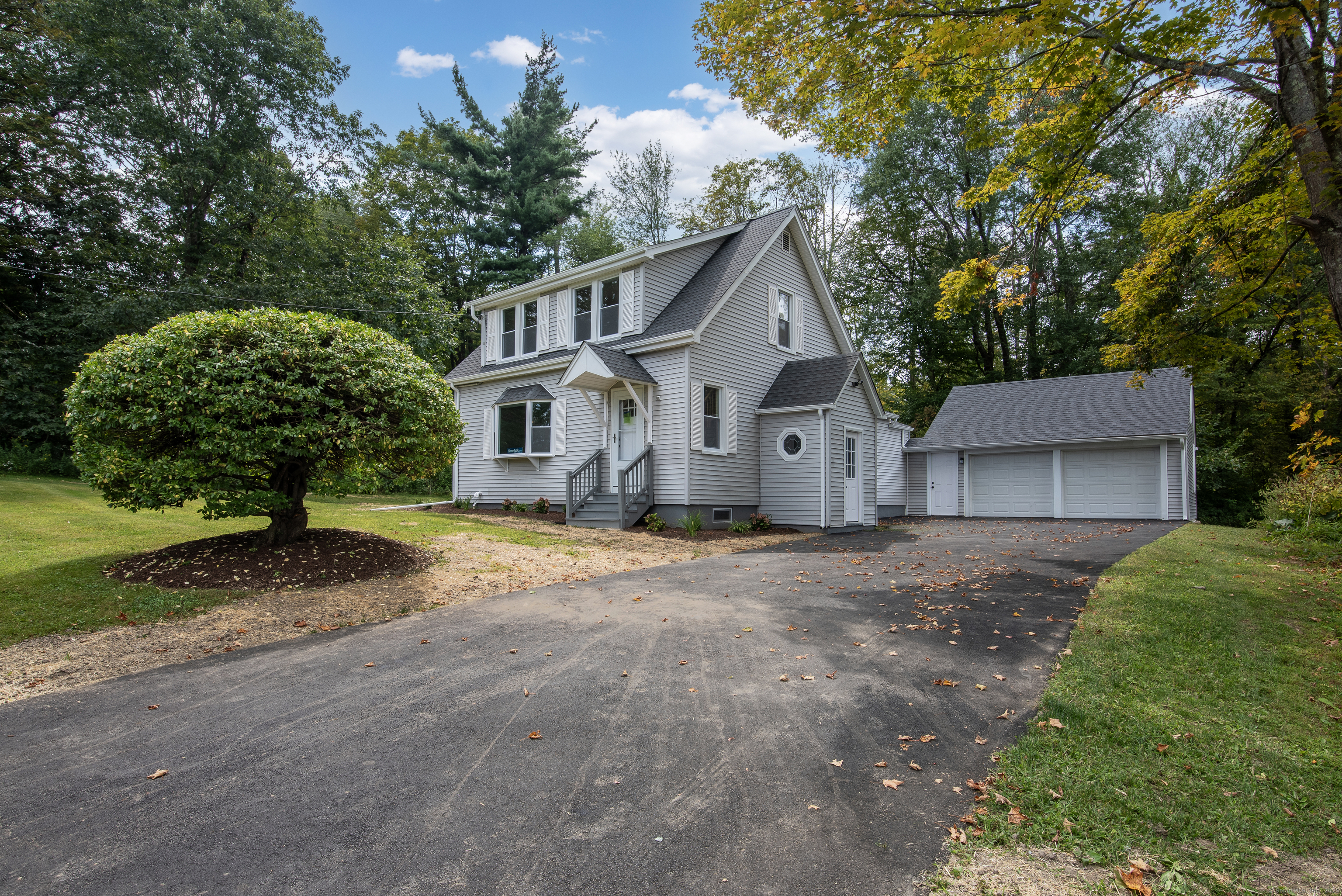 260 Hayden Hill Road Torrington, CT 06790 - Photo 1 of 18 a view of a house with a yard and large trees