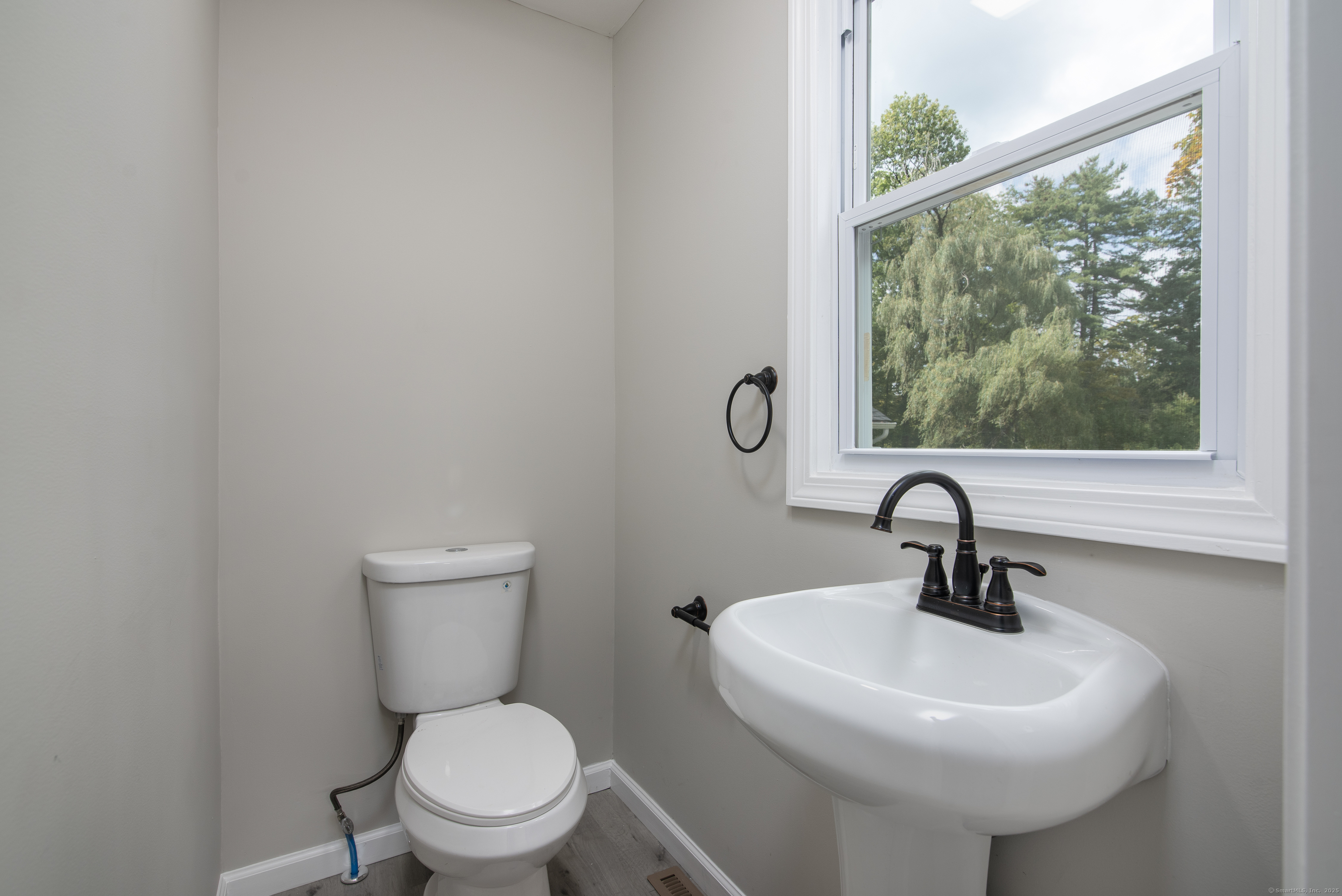260 Hayden Hill Road Torrington, CT 06790 - Photo 12 of 18 a bathroom with a sink toilet and a mirror