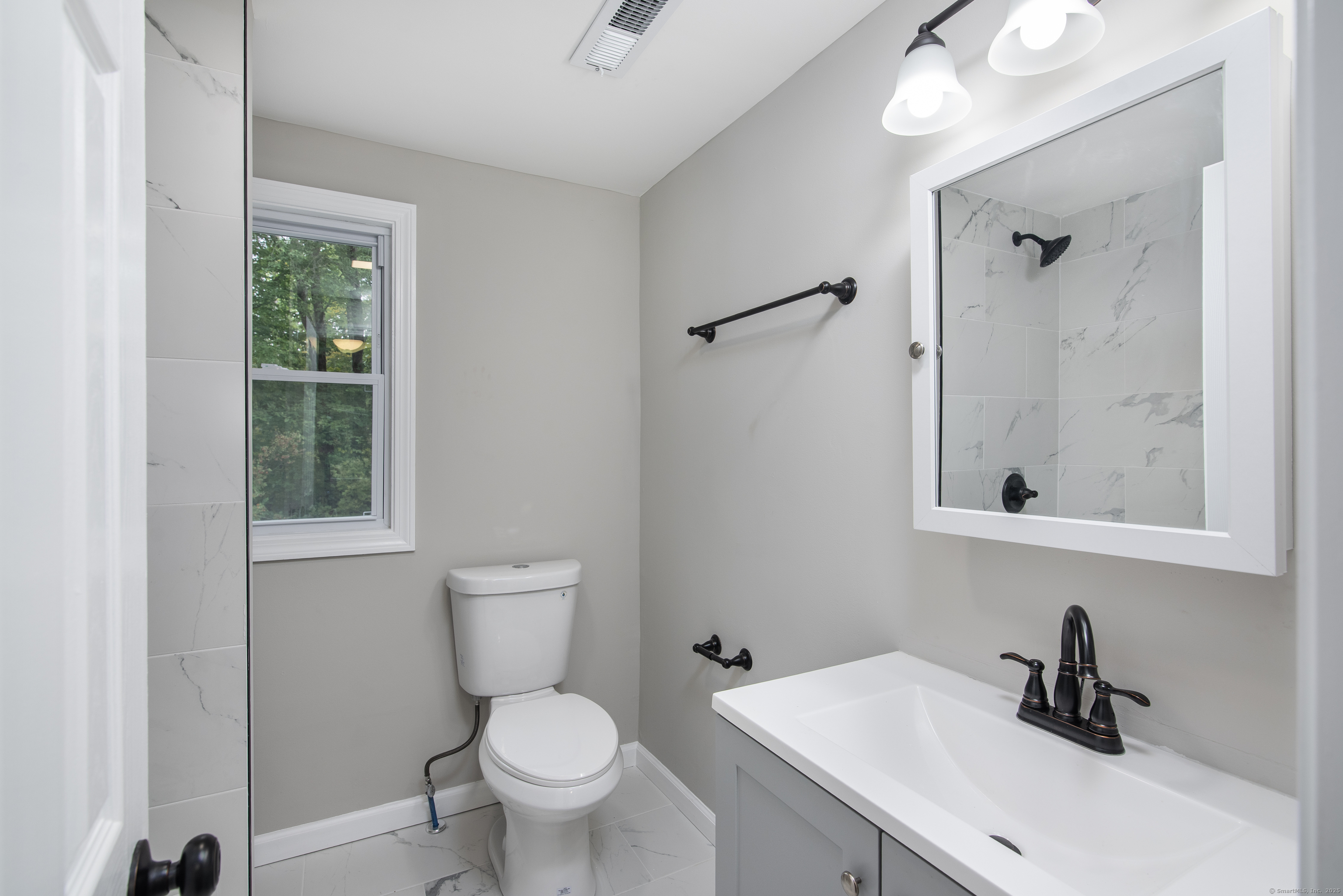260 Hayden Hill Road Torrington, CT 06790 - Photo 14 of 18 a bathroom with a sink a toilet and shower
