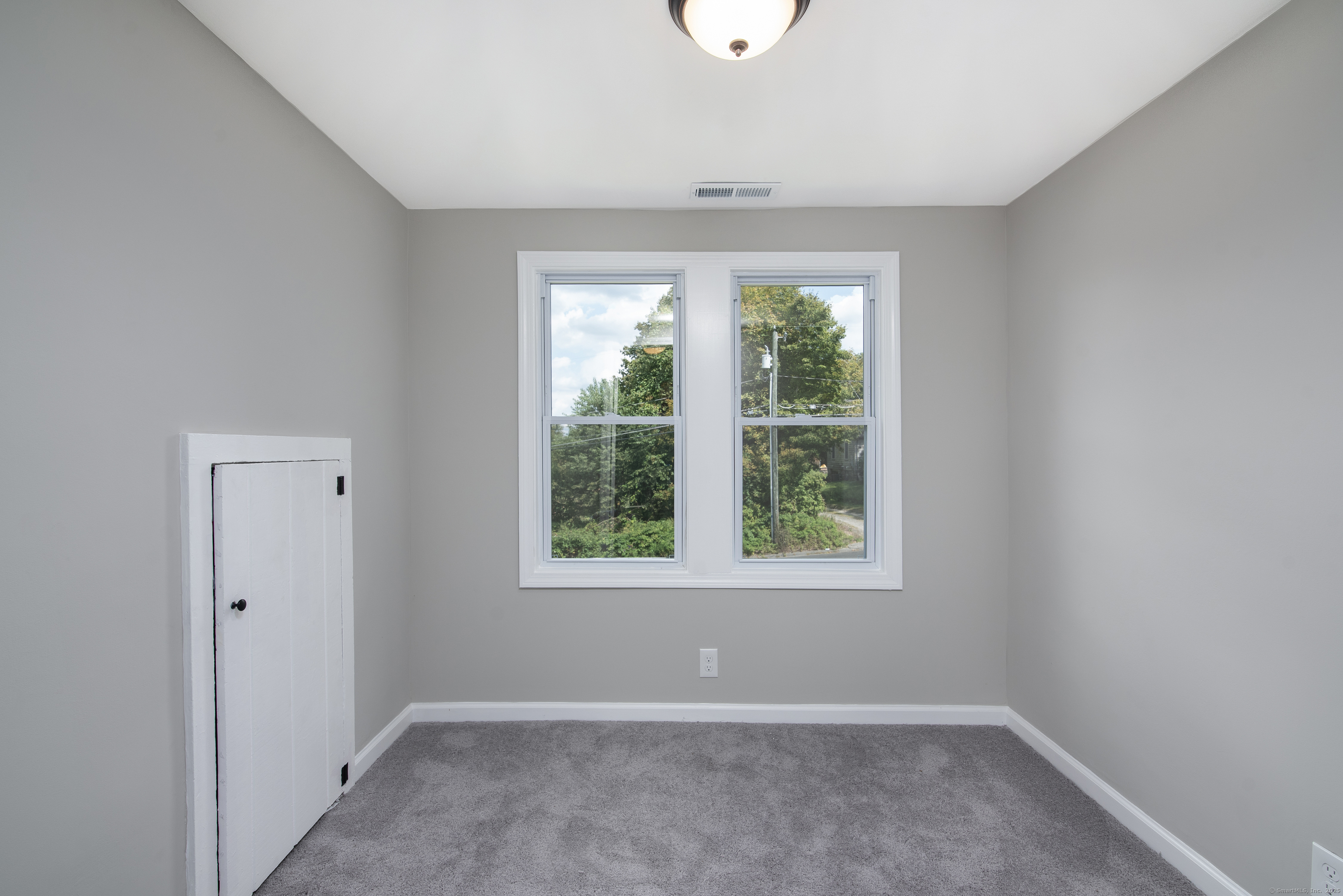 260 Hayden Hill Road Torrington, CT 06790 - Photo 15 of 18 an empty room with a window