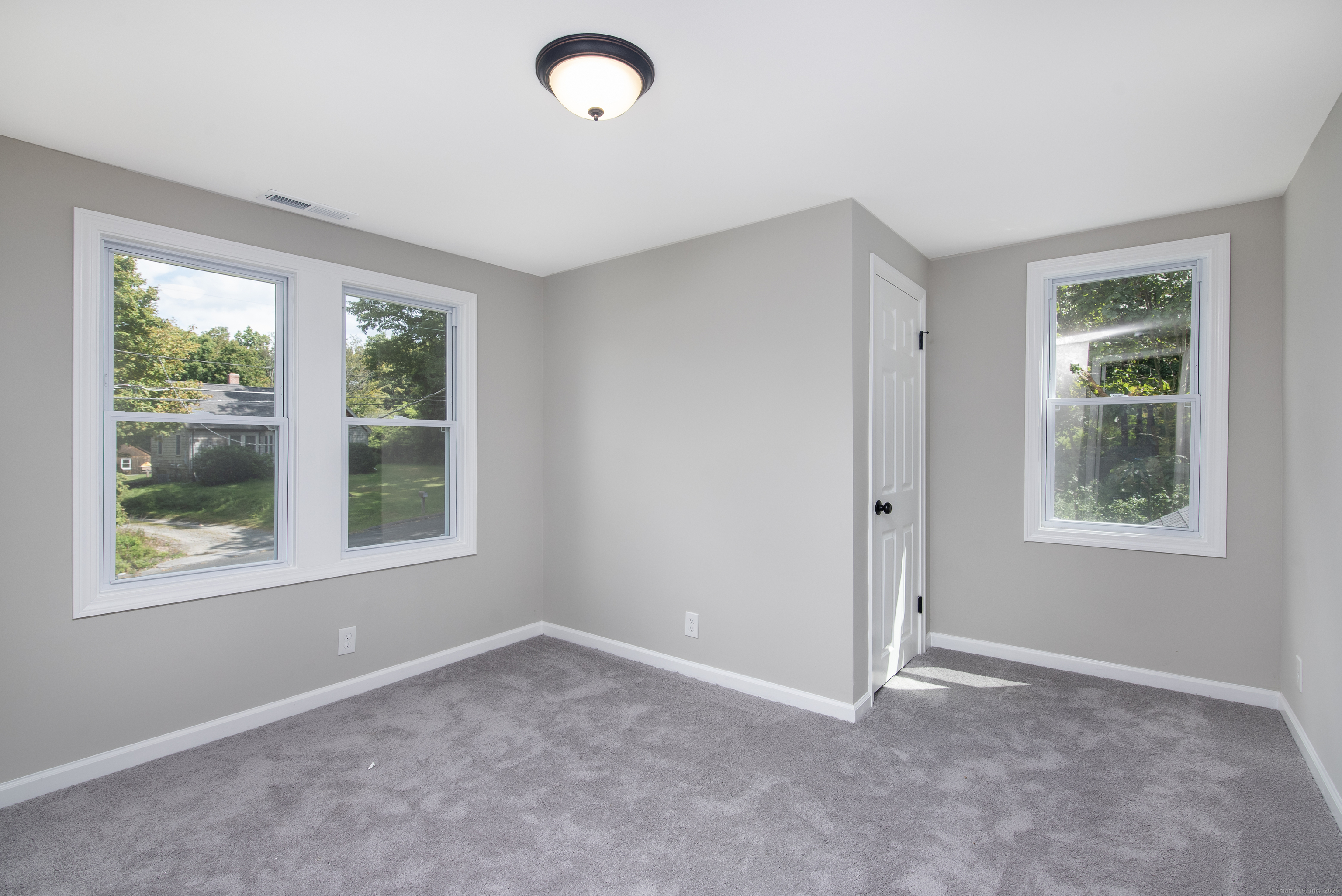 260 Hayden Hill Road Torrington, CT 06790 - Photo 16 of 18 an empty room with windows