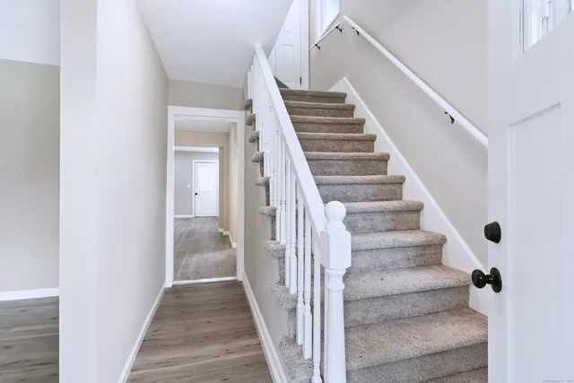 a view of staircase with white walls and white walls