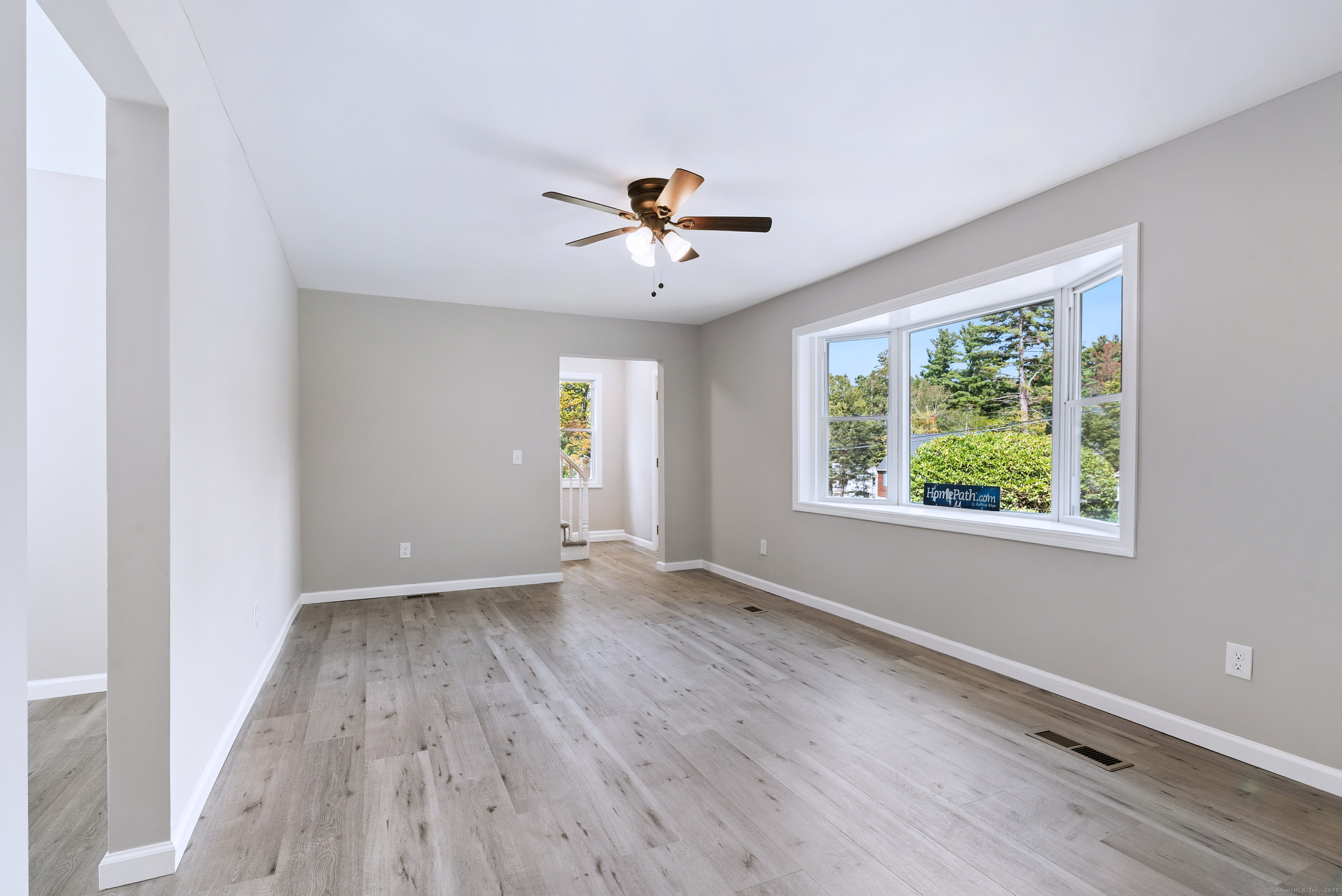 260 Hayden Hill Road Torrington, CT 06790 - Photo 6 of 18 wooden floor in an empty room with a window