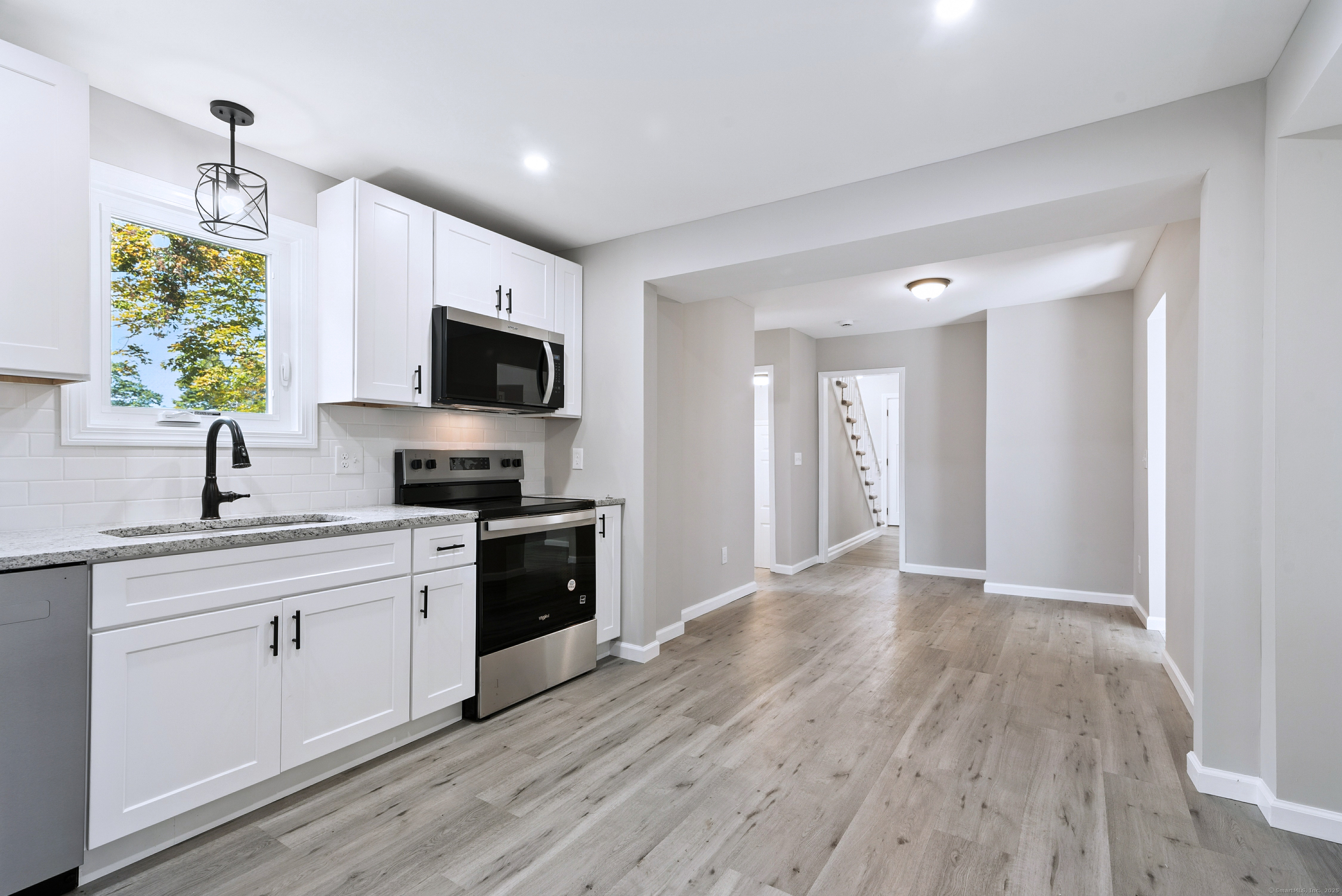 260 Hayden Hill Road Torrington, CT 06790 - Photo 9 of 18 a view of a kitchen cabinets and wooden floor