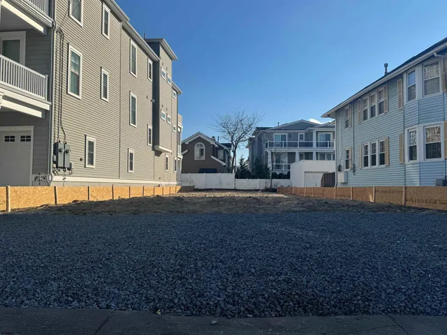 a view of road with large house