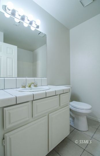 649 Regency Court Ridgecrest, CA 93555 - Photo 18 of 31 a bathroom with a sink and a toilet