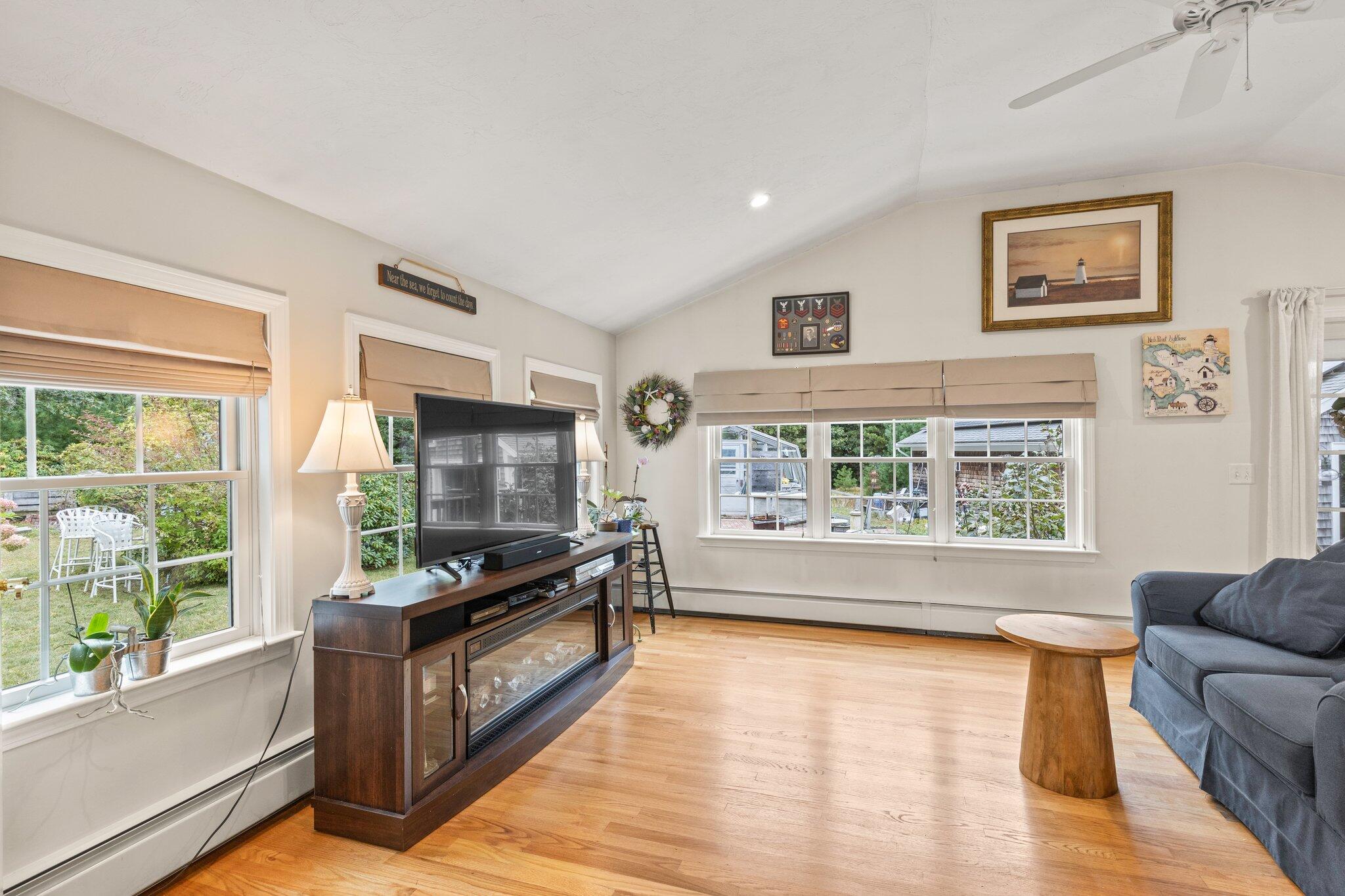 3 Fathom Lane Wareham, MA 02571 - Photo 12 of 57 a living room with furniture and a flat screen tv