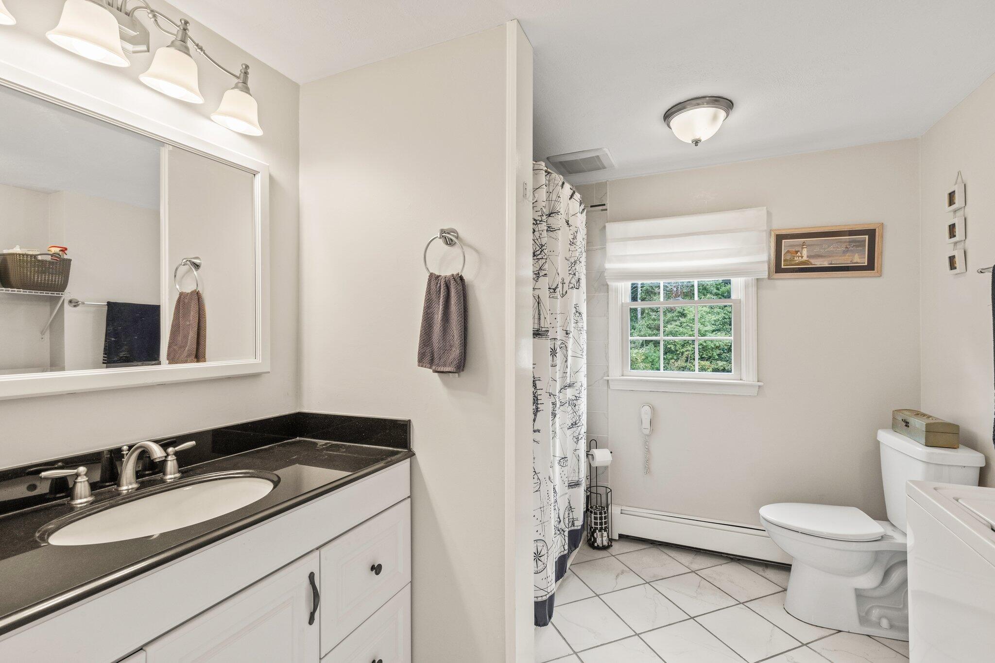 3 Fathom Lane Wareham, MA 02571 - Photo 17 of 57 a bathroom with a granite countertop sink toilet and mirror