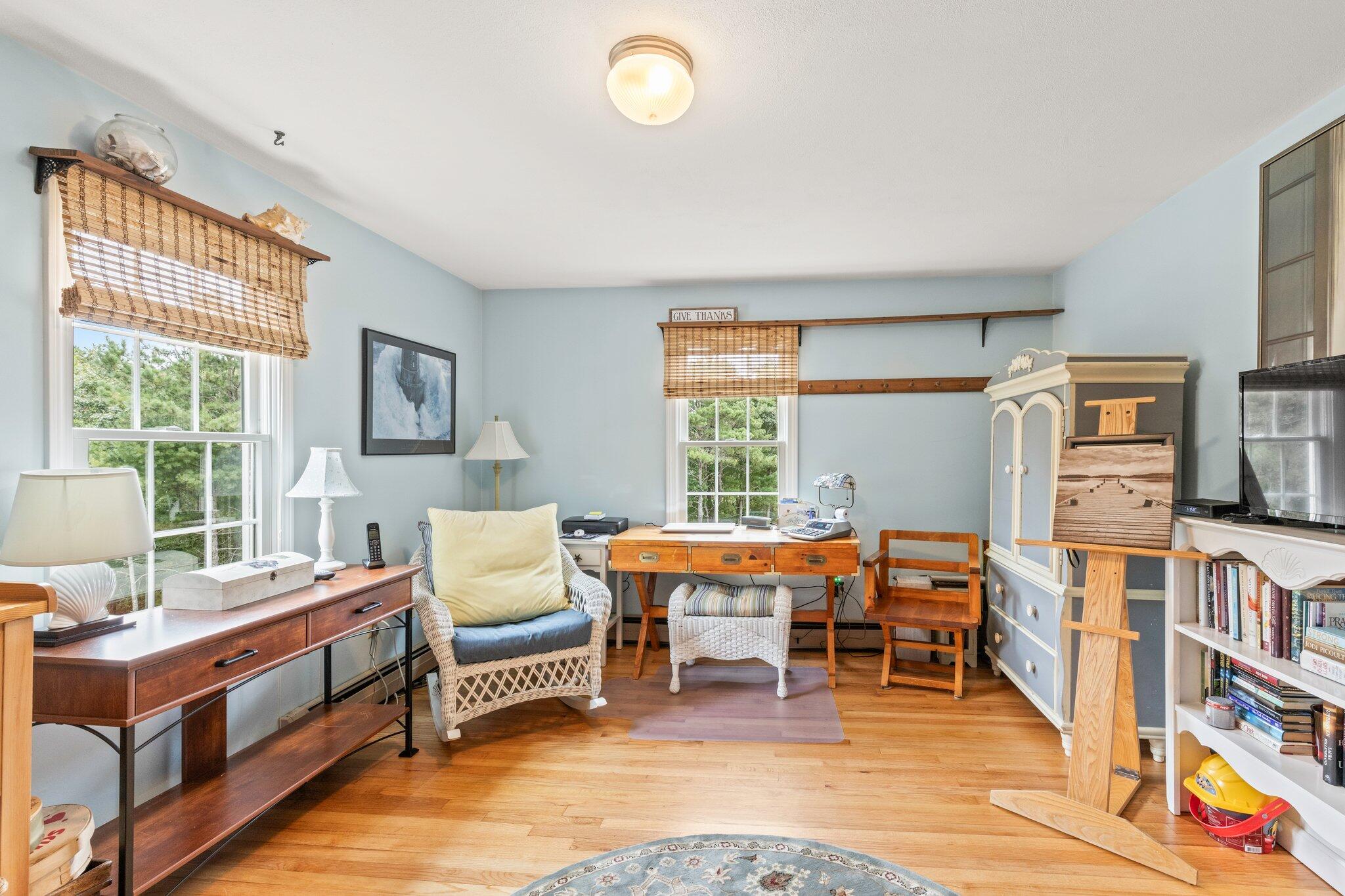 3 Fathom Lane Wareham, MA 02571 - Photo 22 of 57 a living room with furniture and a book shelf