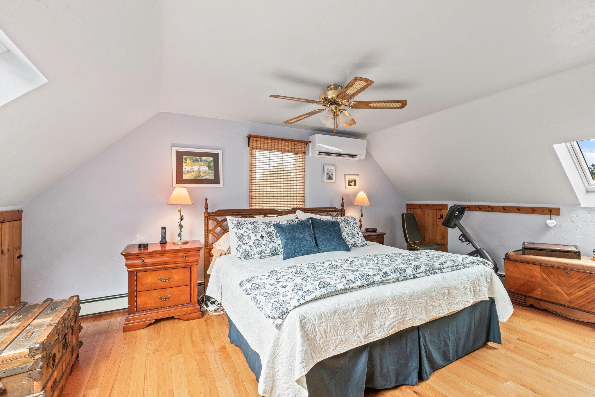 3 Fathom Lane Wareham, MA 02571 - Photo 24 of 57 a bedroom with a bed and a chandelier