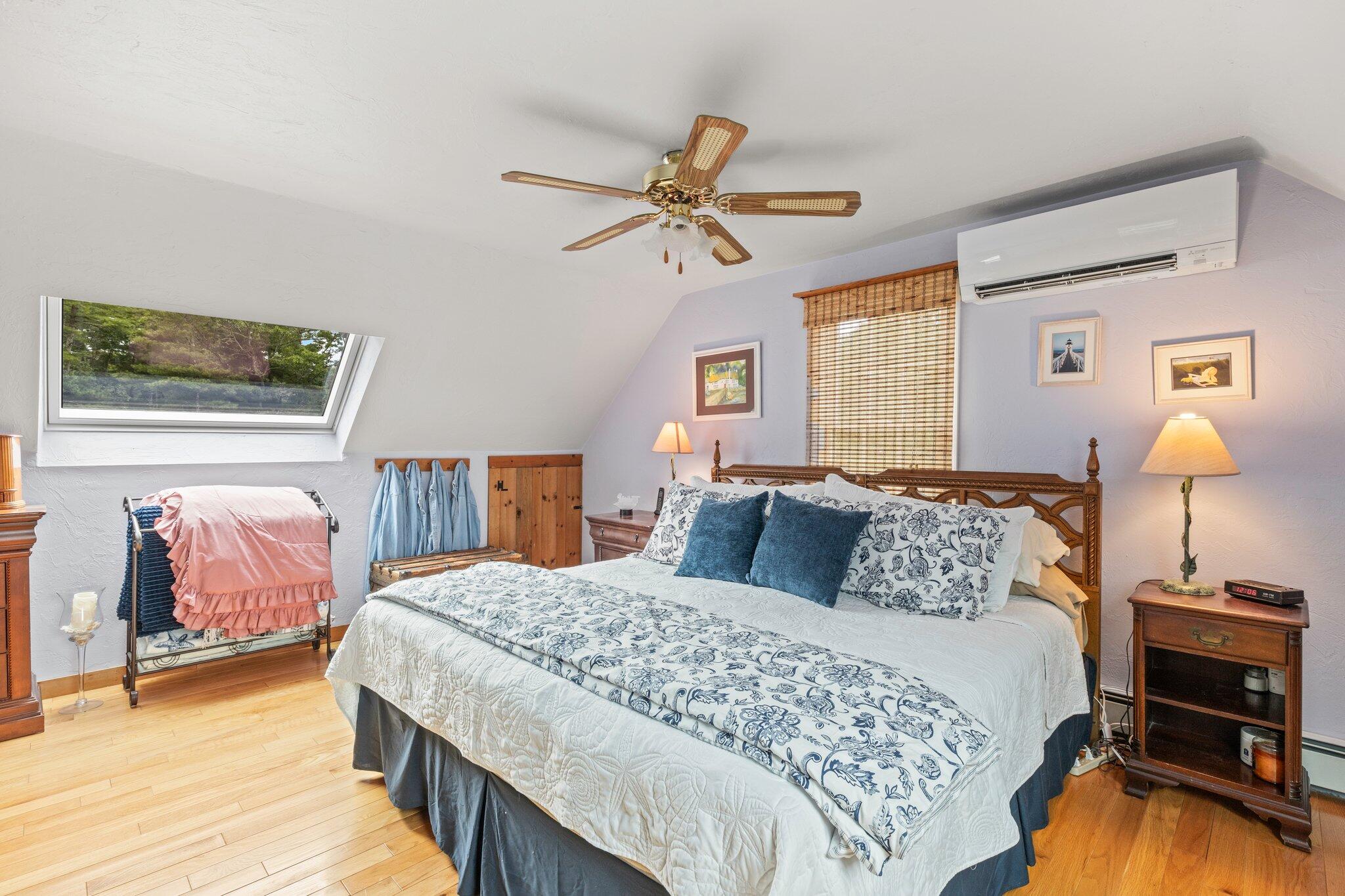 3 Fathom Lane Wareham, MA 02571 - Photo 25 of 57 a bedroom with a bed and a chandelier