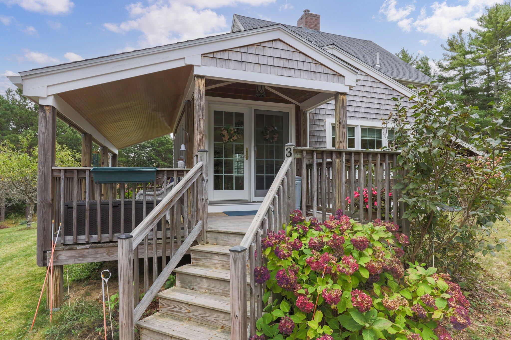 3 Fathom Lane Wareham, MA 02571 - Photo 31 of 57 a view of a house with wooden floor and a flower garden