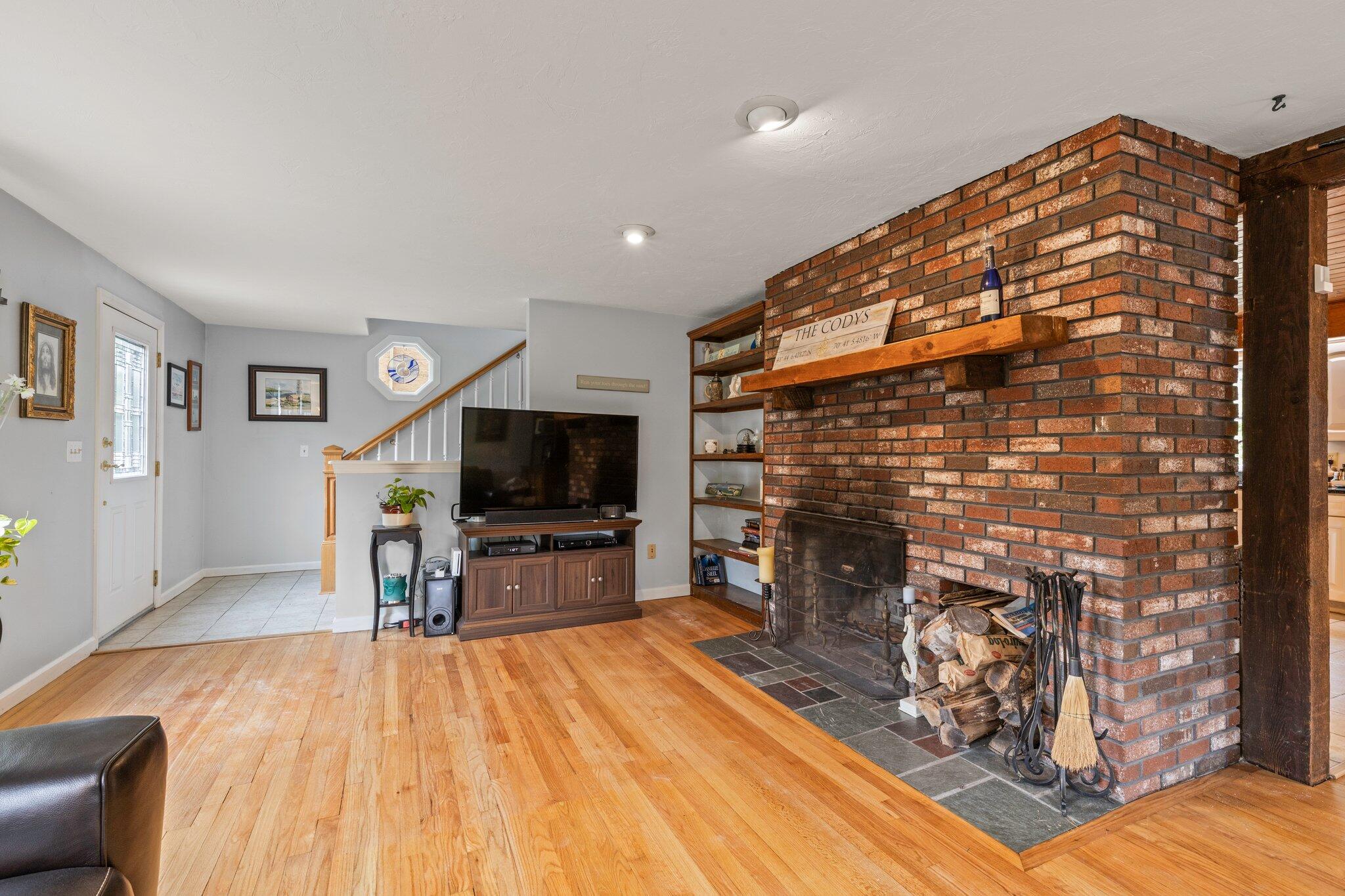 3 Fathom Lane Wareham, MA 02571 - Photo 5 of 57 a living room with fireplace furniture and a flat screen tv