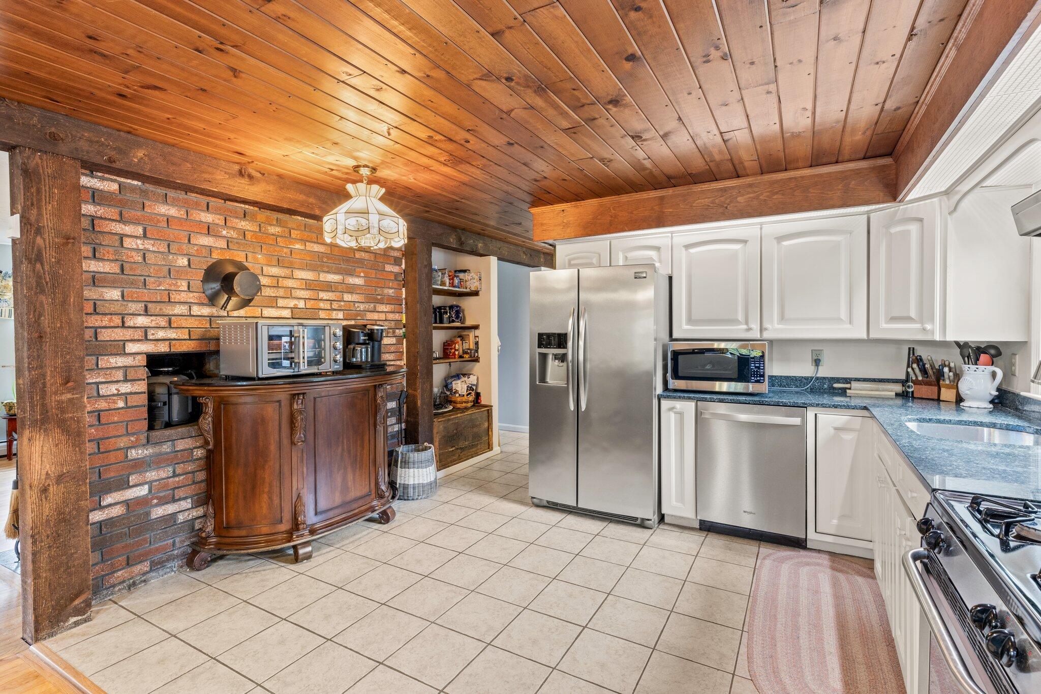 3 Fathom Lane Wareham, MA 02571 - Photo 9 of 57 a kitchen with stainless steel appliances granite countertop a refrigerator a sink and dishwasher